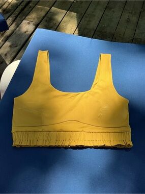 Fabletics Mustard Yellow Ruffle Hem Sports Bra
